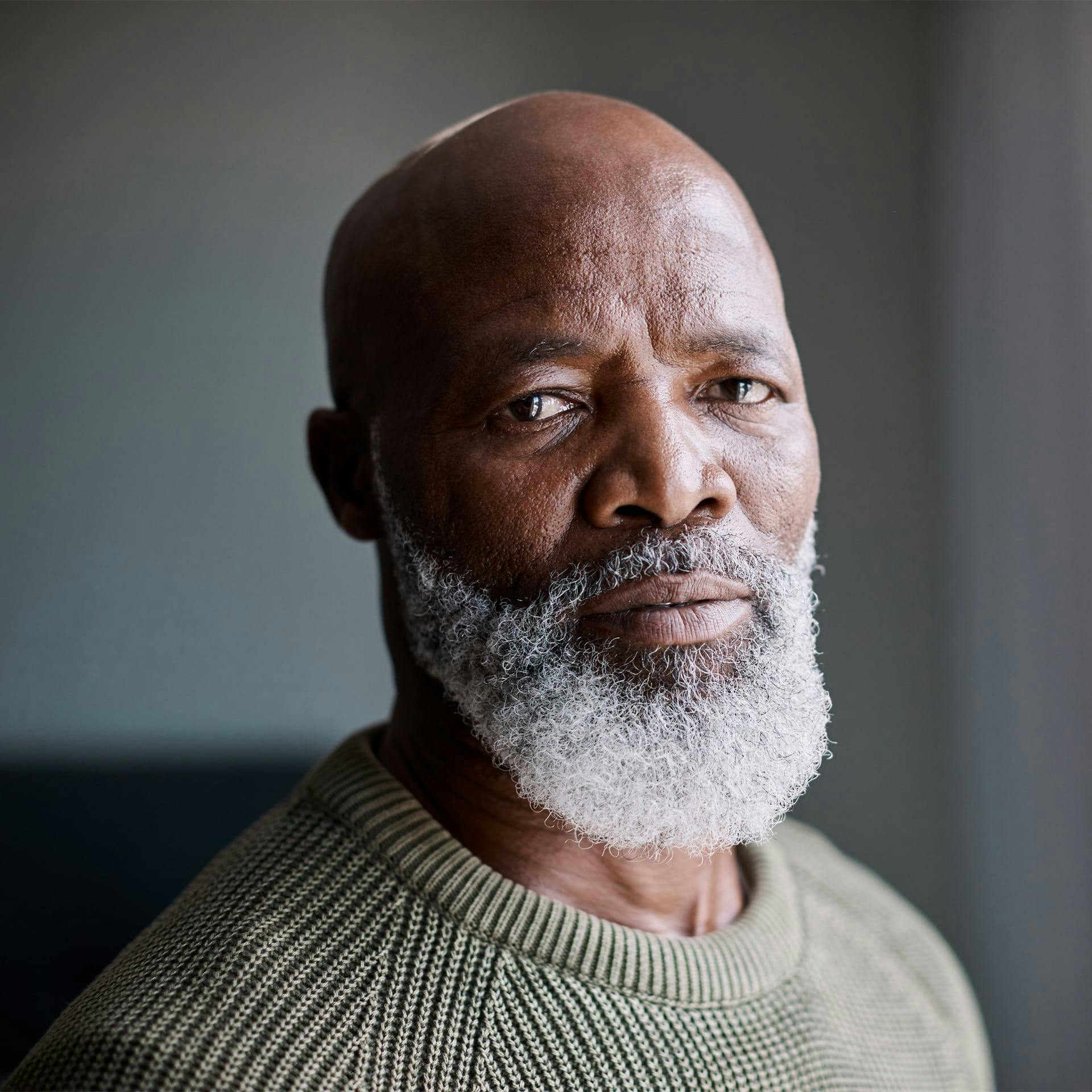 older man looking to the camera