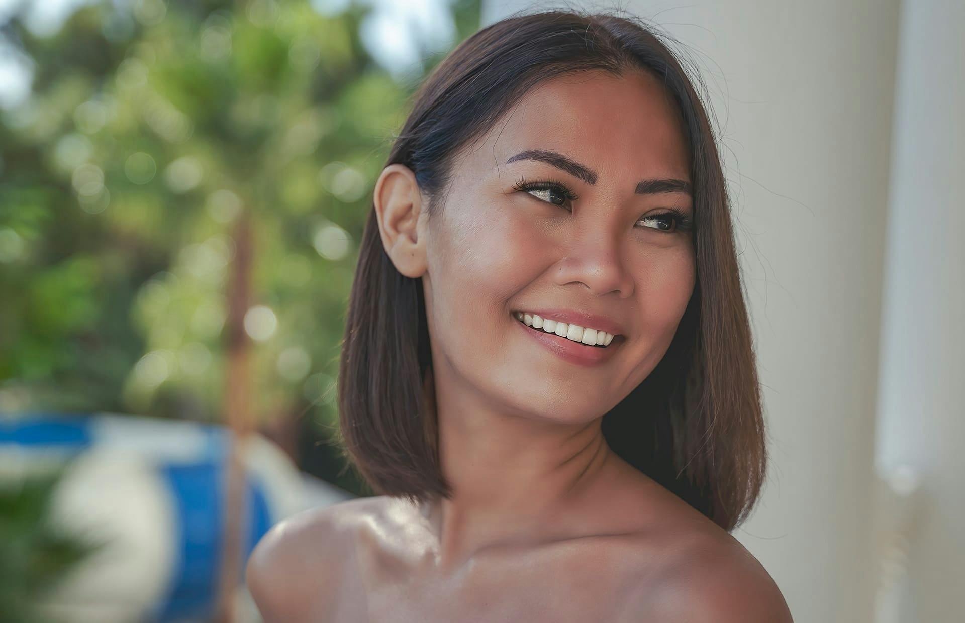 Woman smiling looking over shoulder
