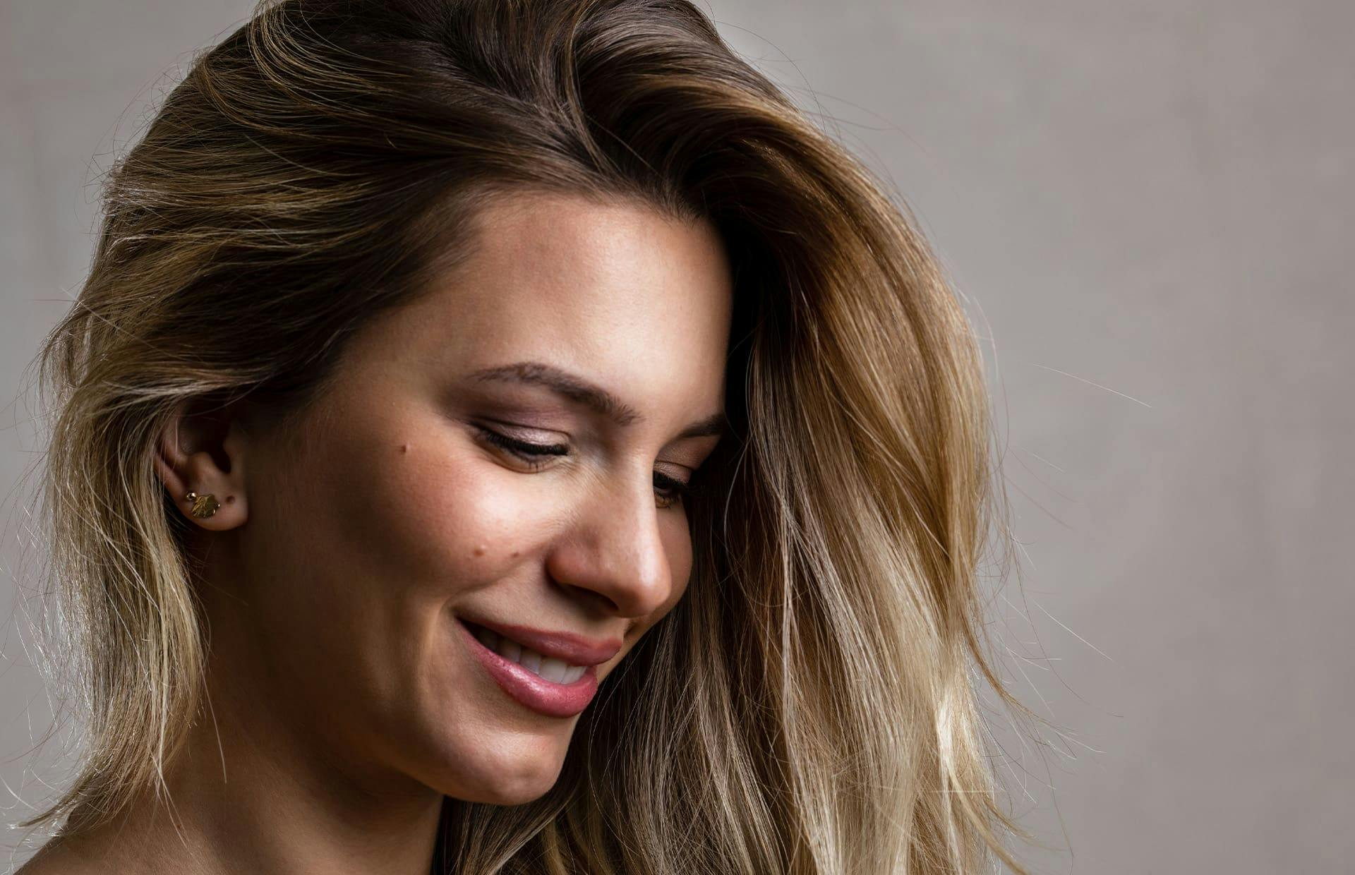 Woman smiling looking down