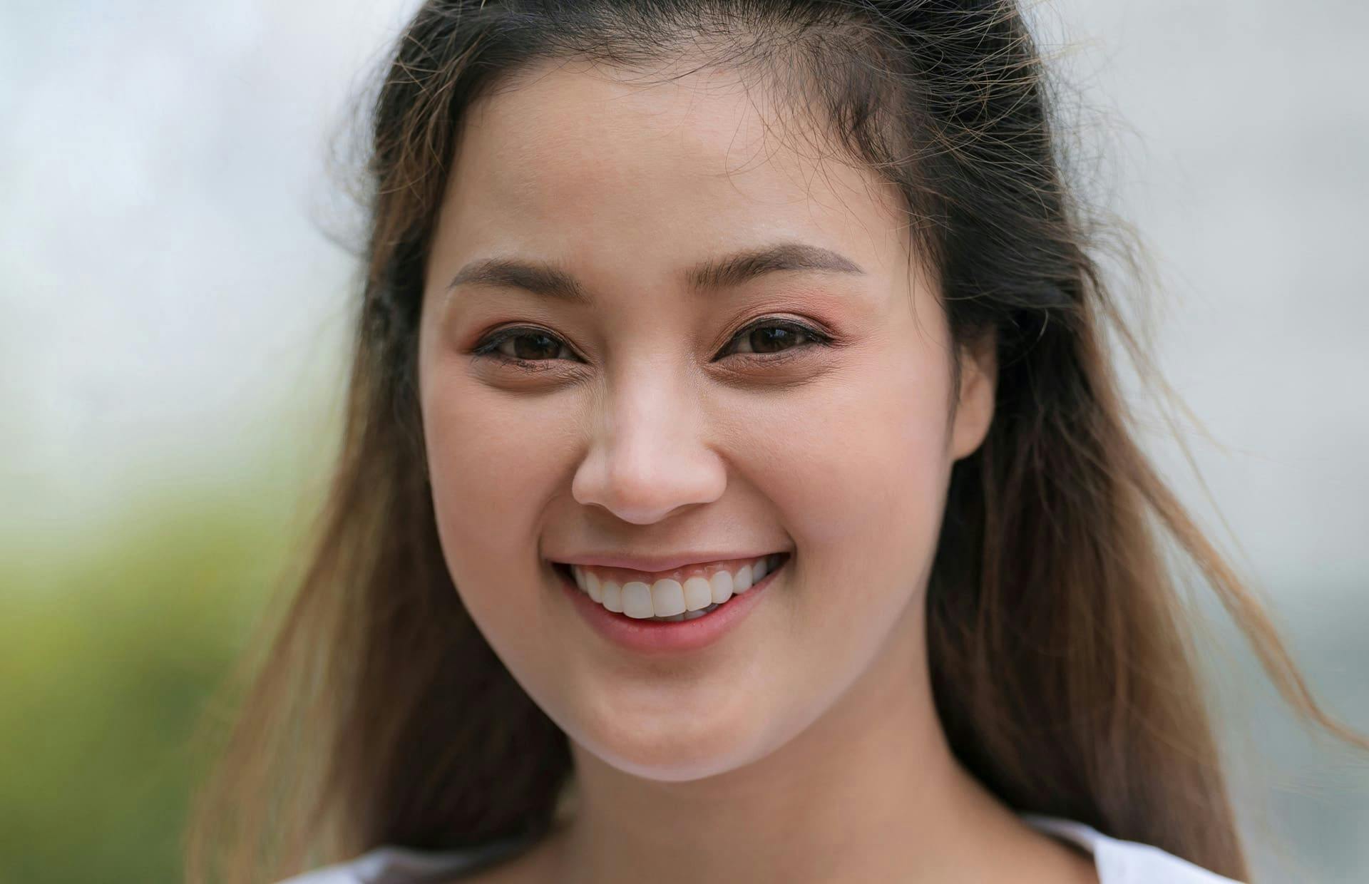 Woman smiling outside