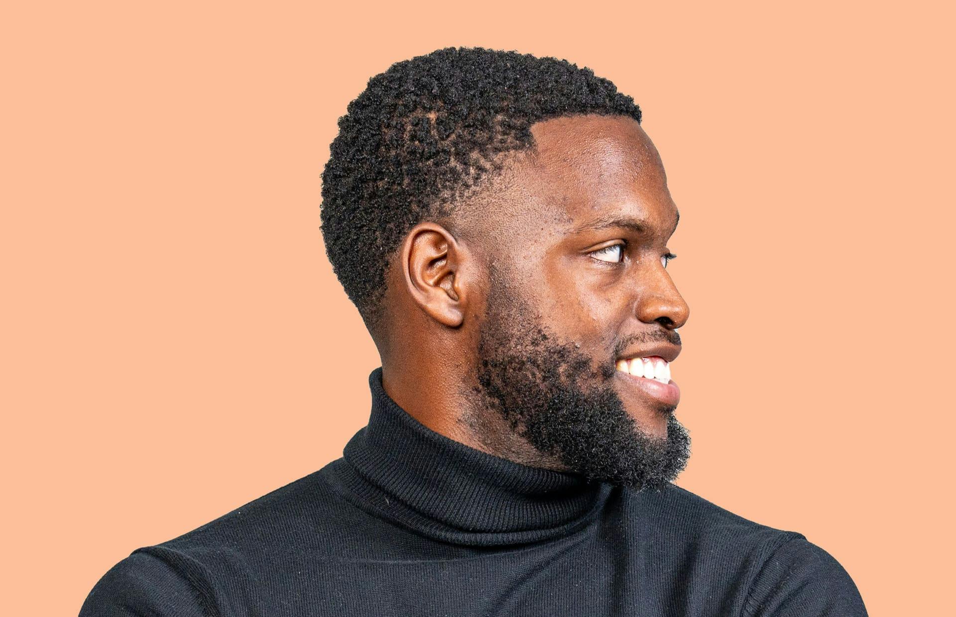 Man looking to the side and smiling