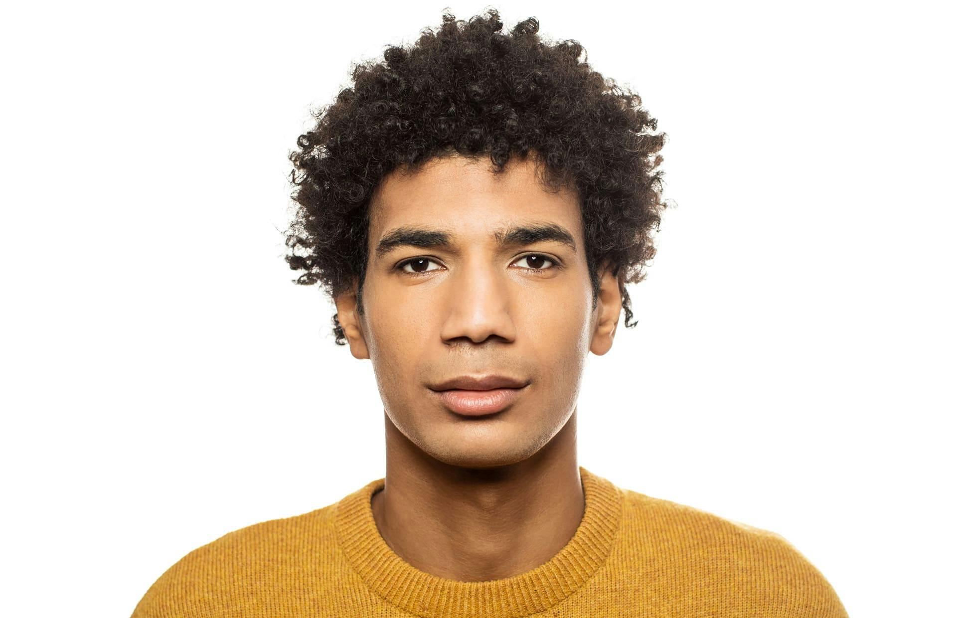 Man smiling against white background