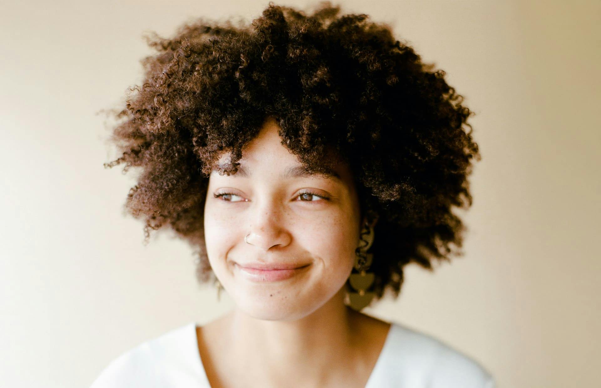 Woman with curly hair smiling