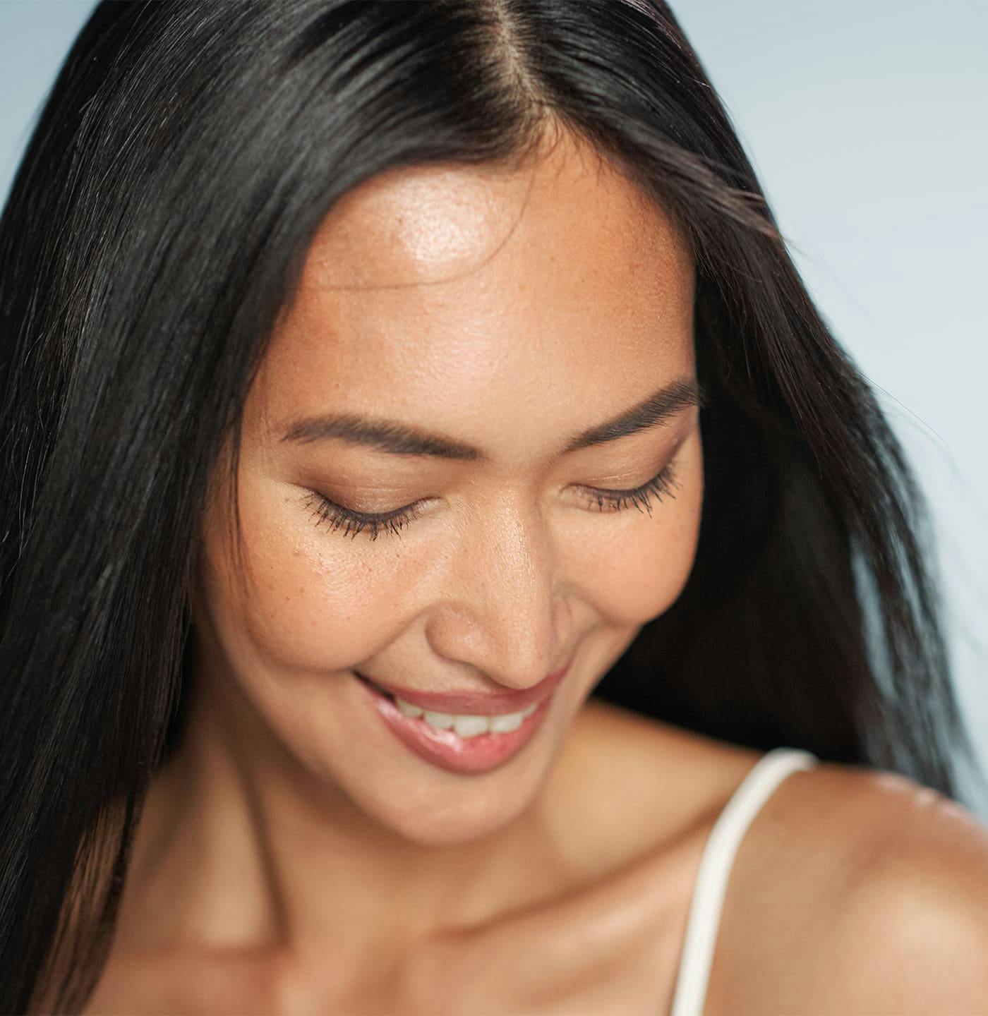 Woman looking down and smiling
