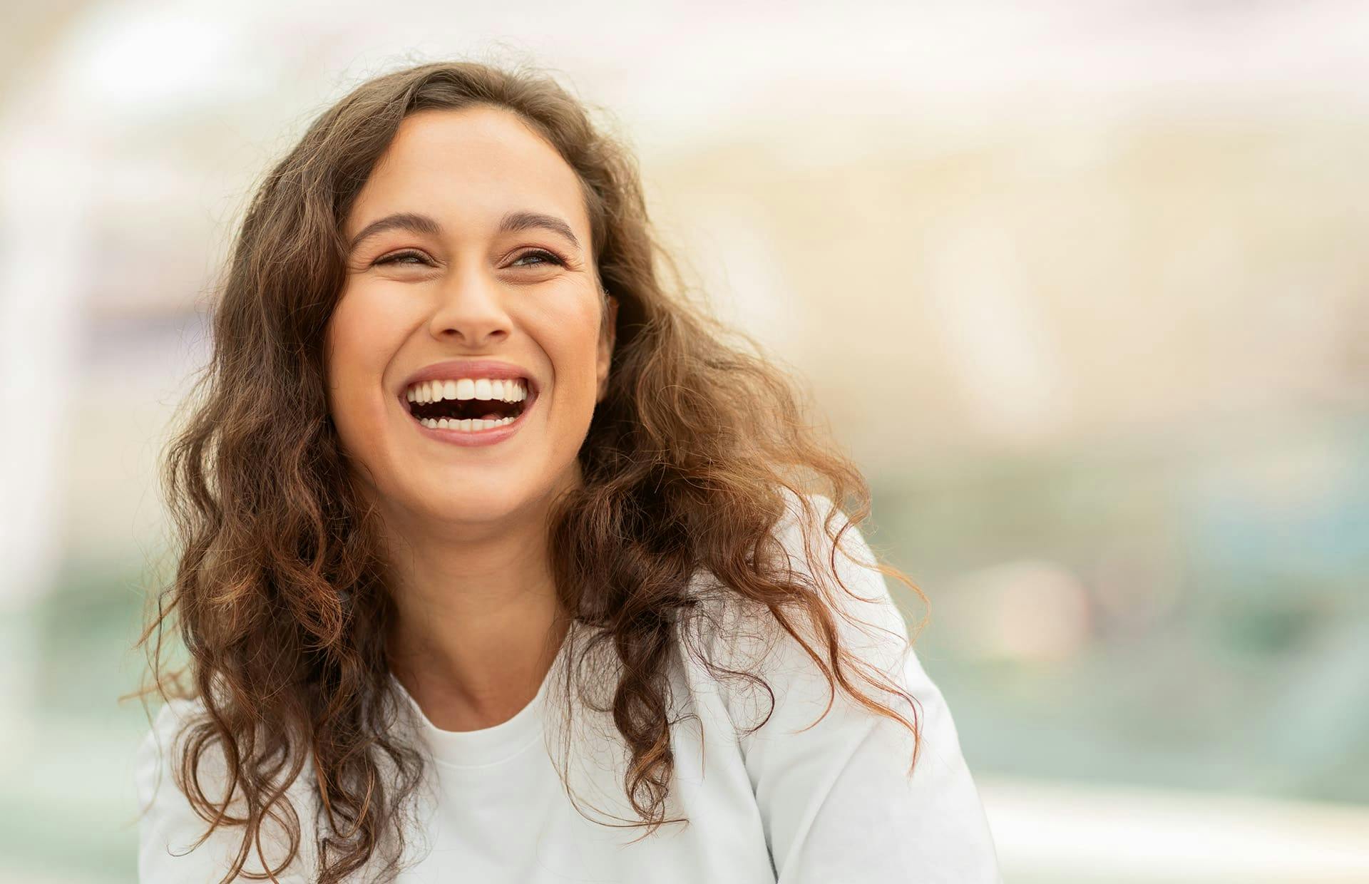 Woman laughing outside