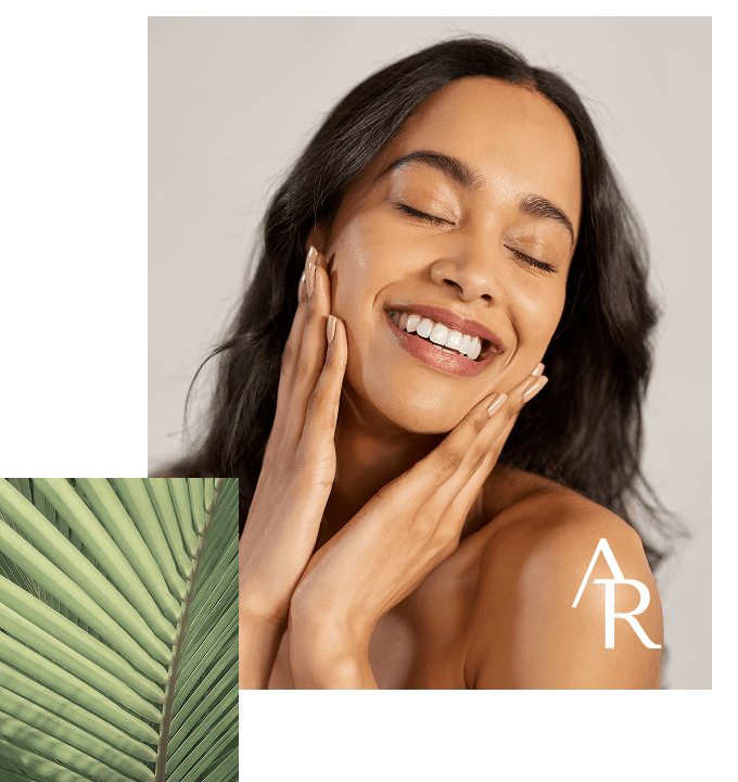 woman touching her face and smiling