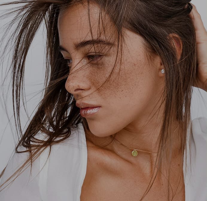woman with shoulder length brown hair smiling