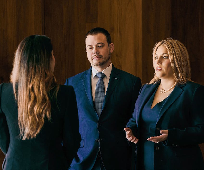 Lawyers and client speaking