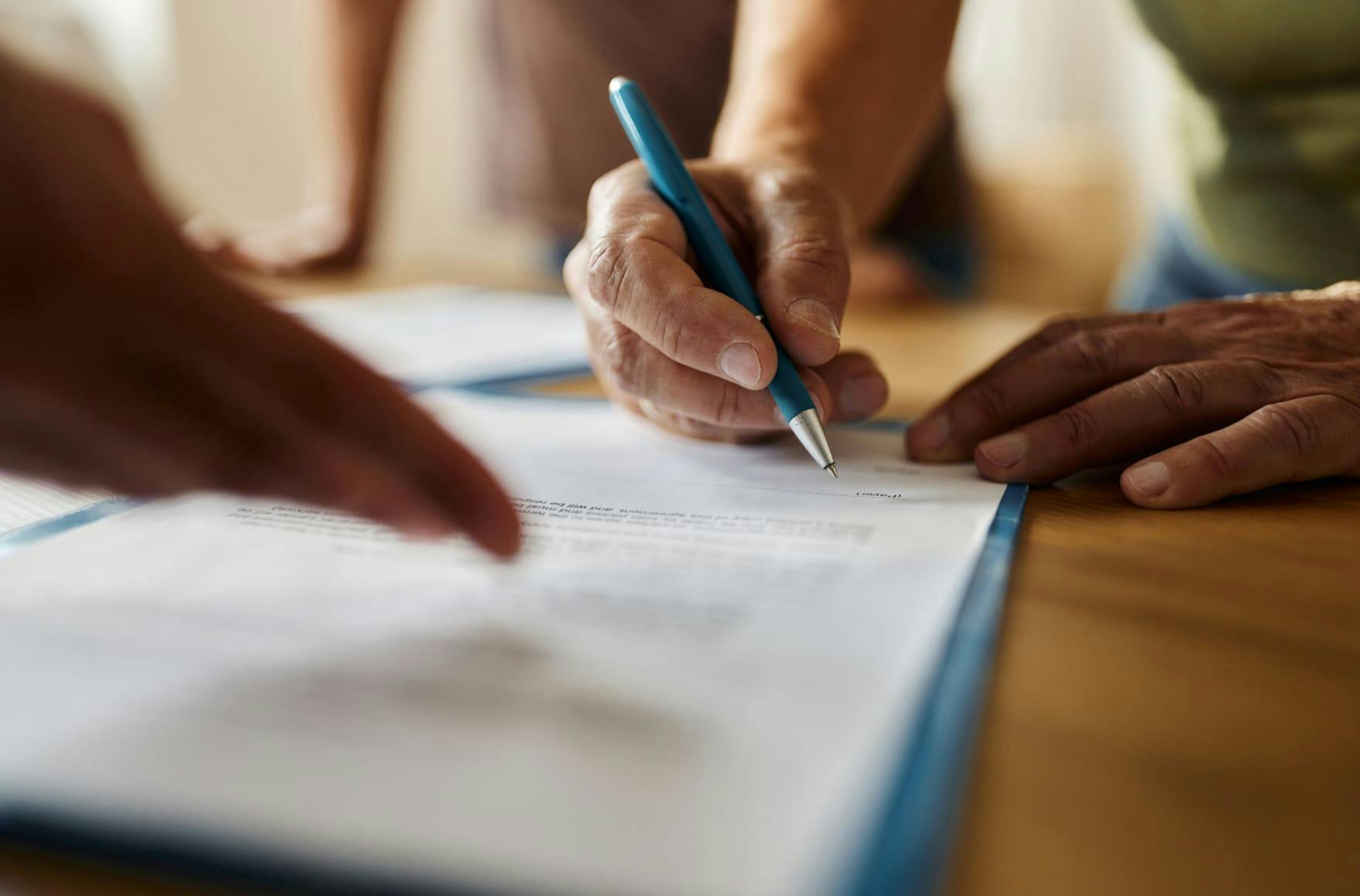 A person writing on paper