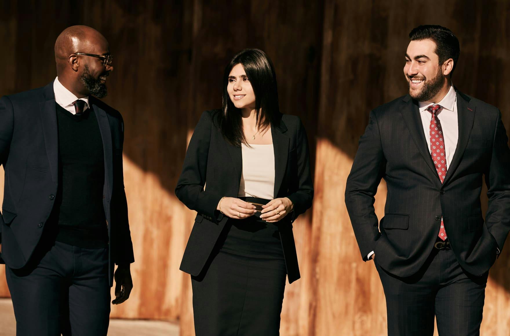 Three lawyers smiling
