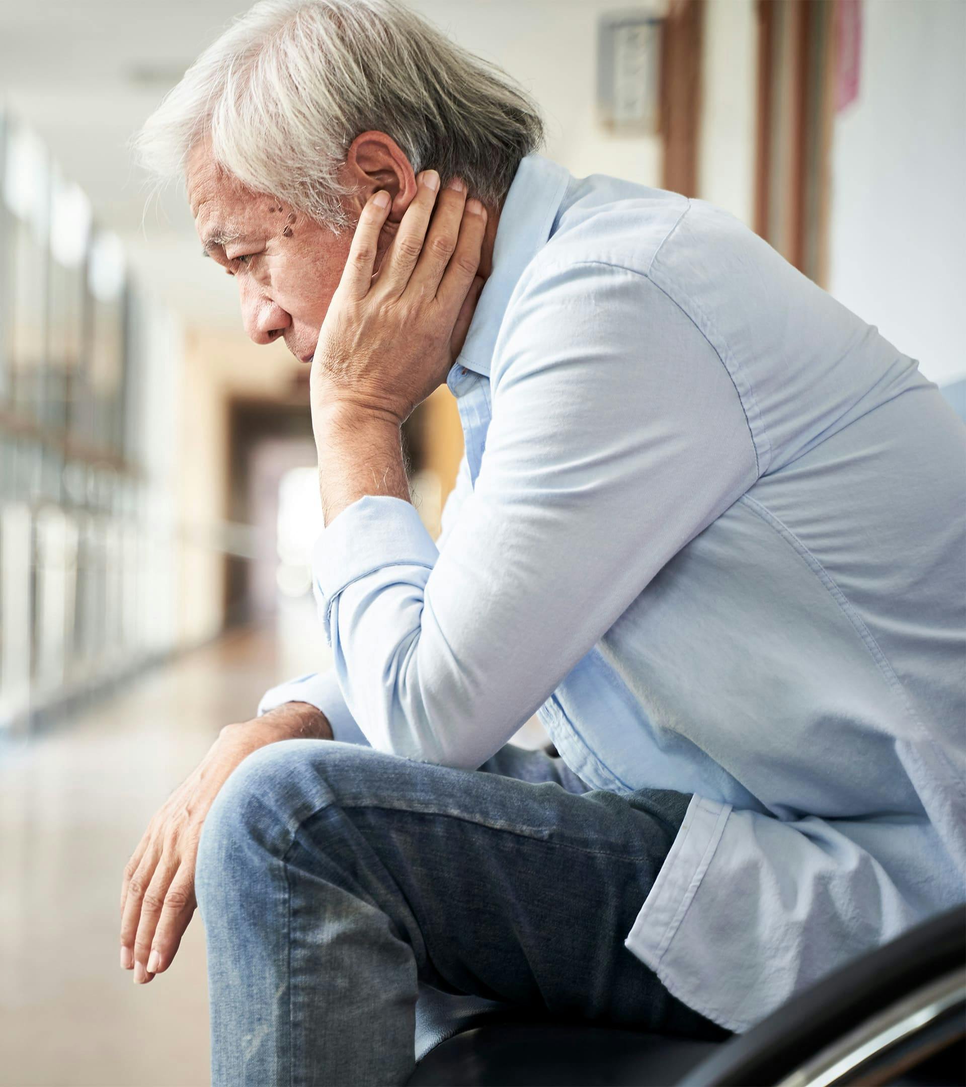 Person leaning over in chair nervous