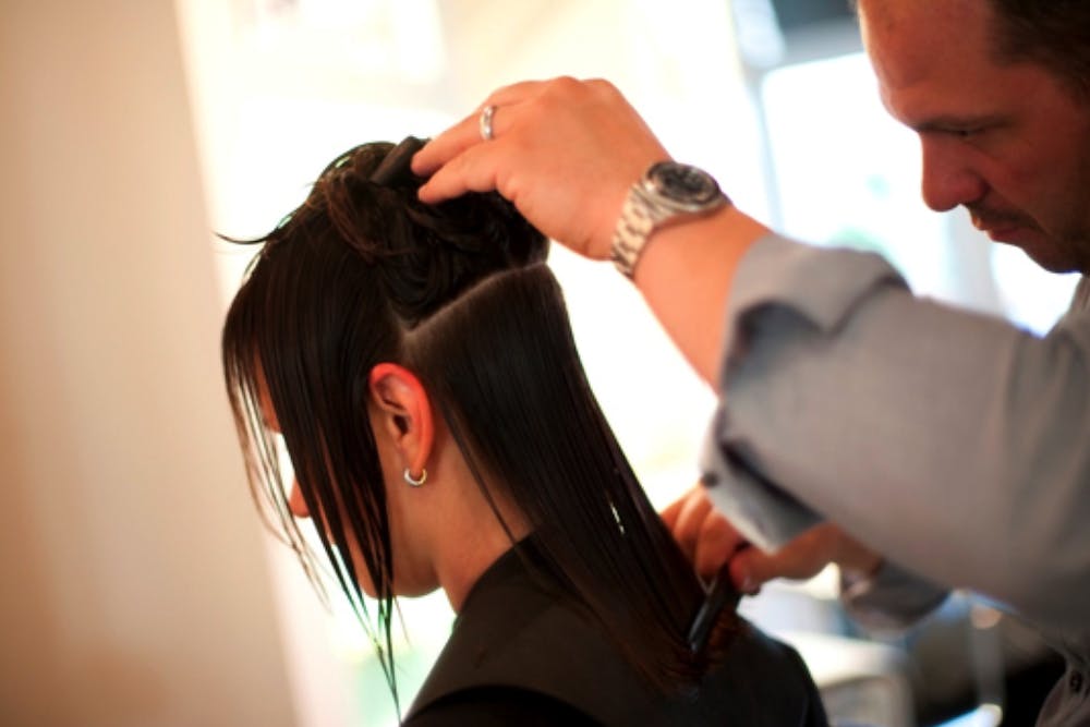 hair-stylist-styling-womans-hair