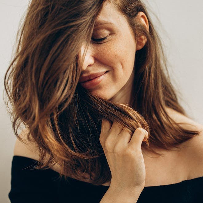 woman with her hair infront of her face