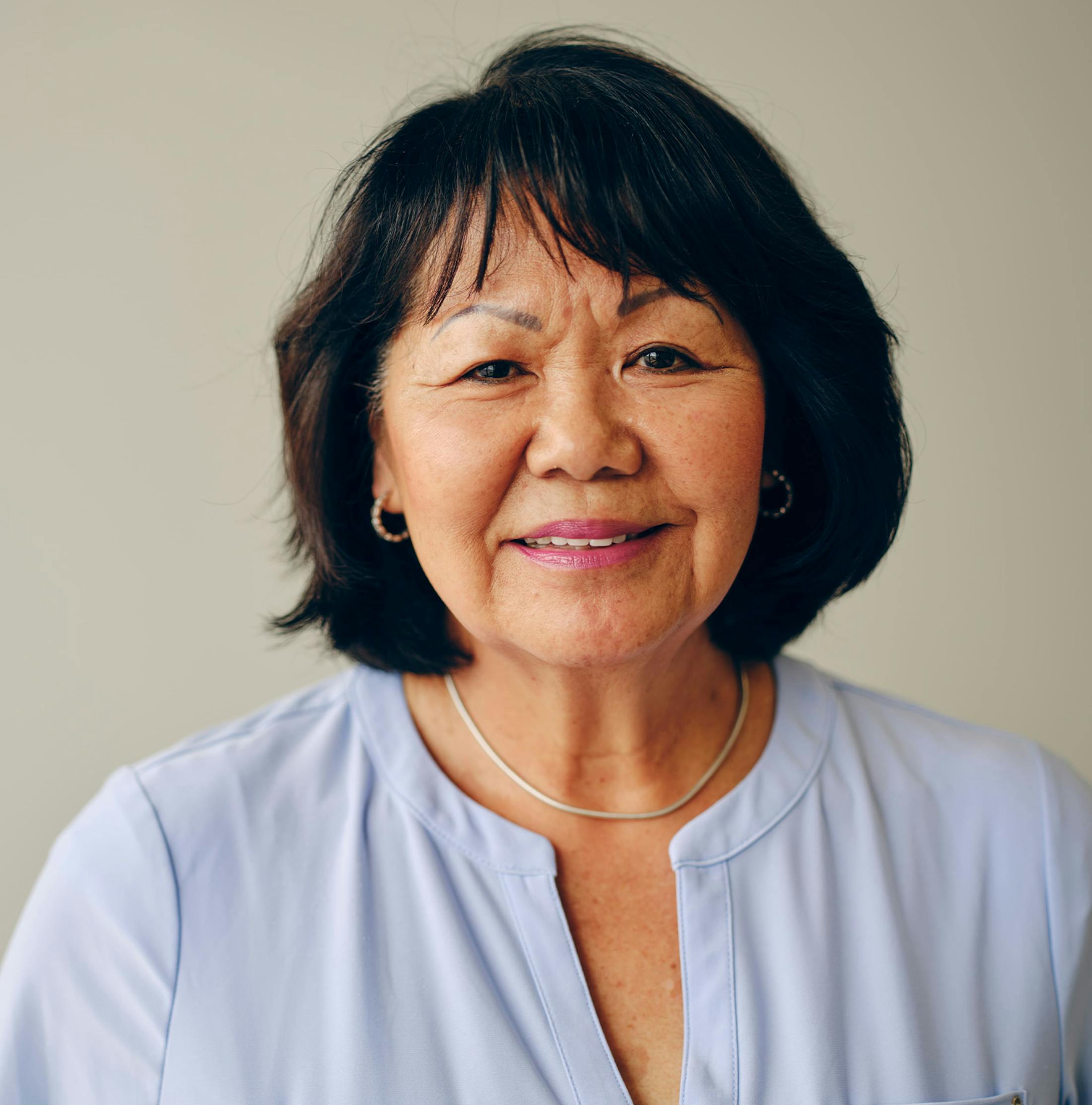 woman with bob haircut smiling