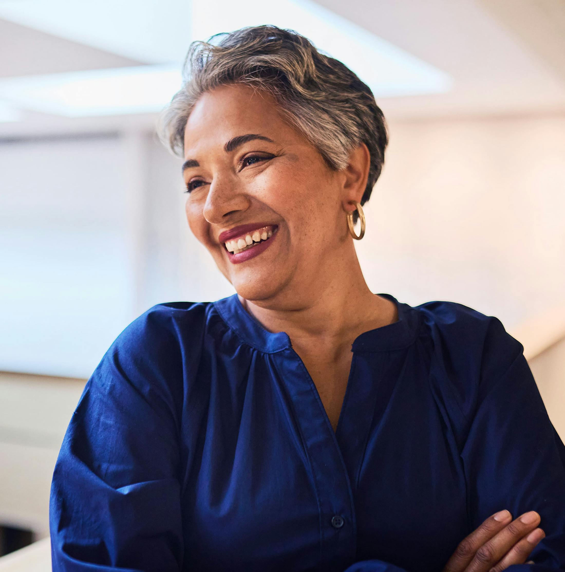 woman smiling in dark blue top
