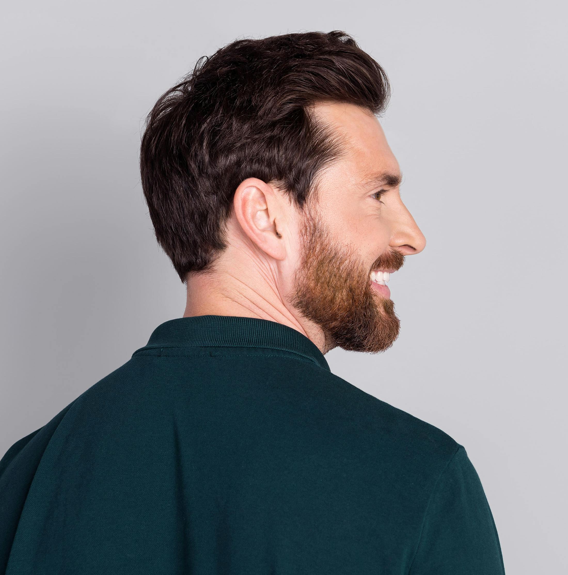 man's backside as his face is tilted to the right