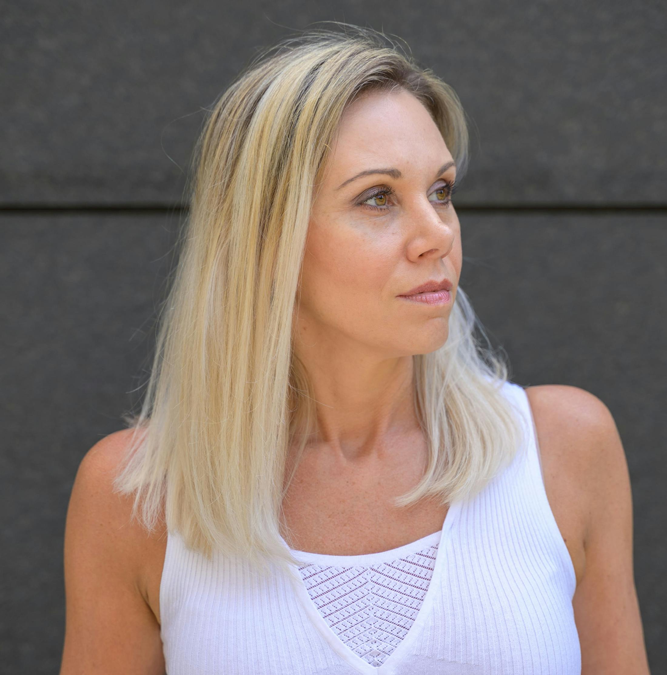 blonde woman facing to the right