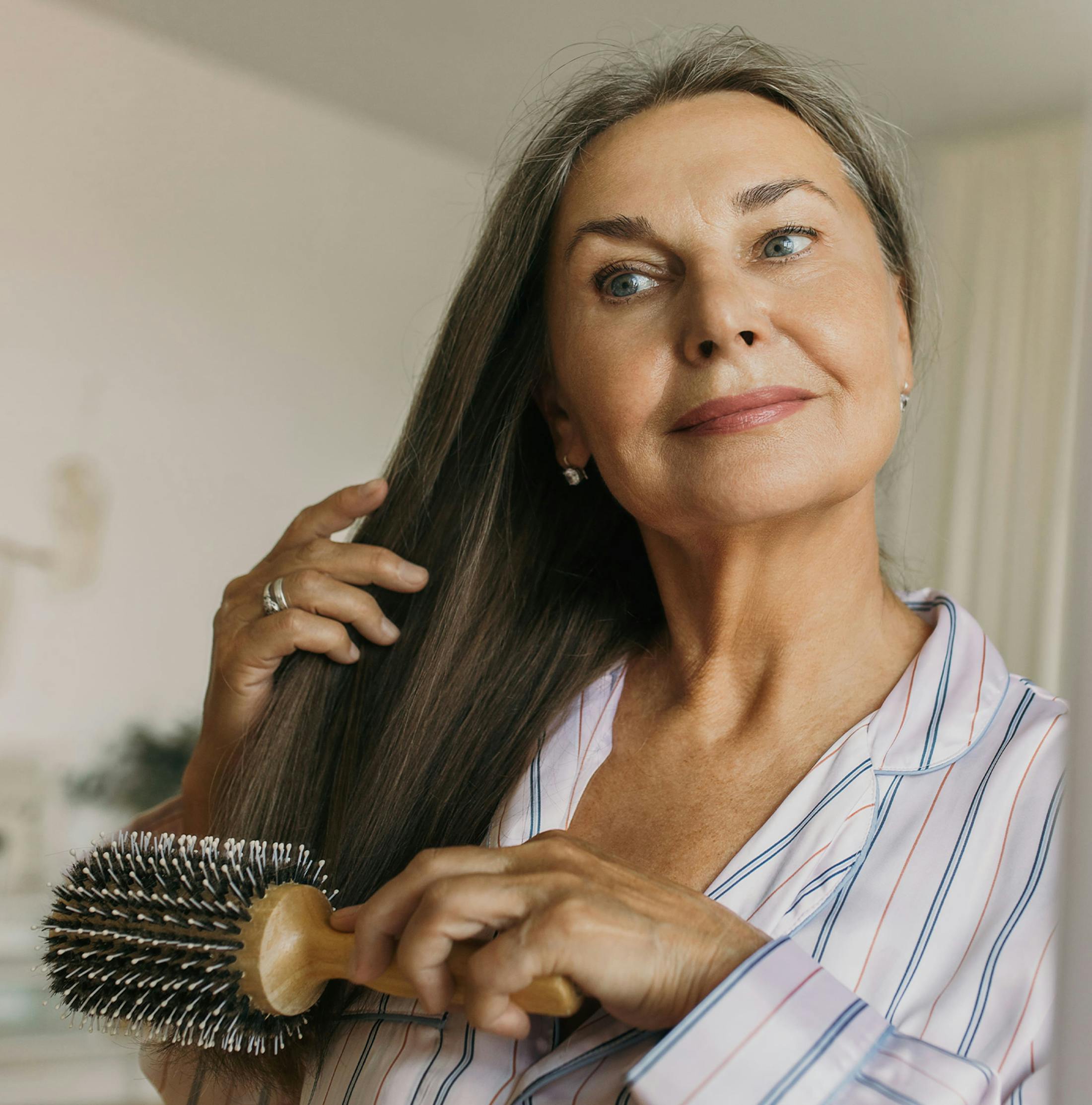 woman brushing her hair