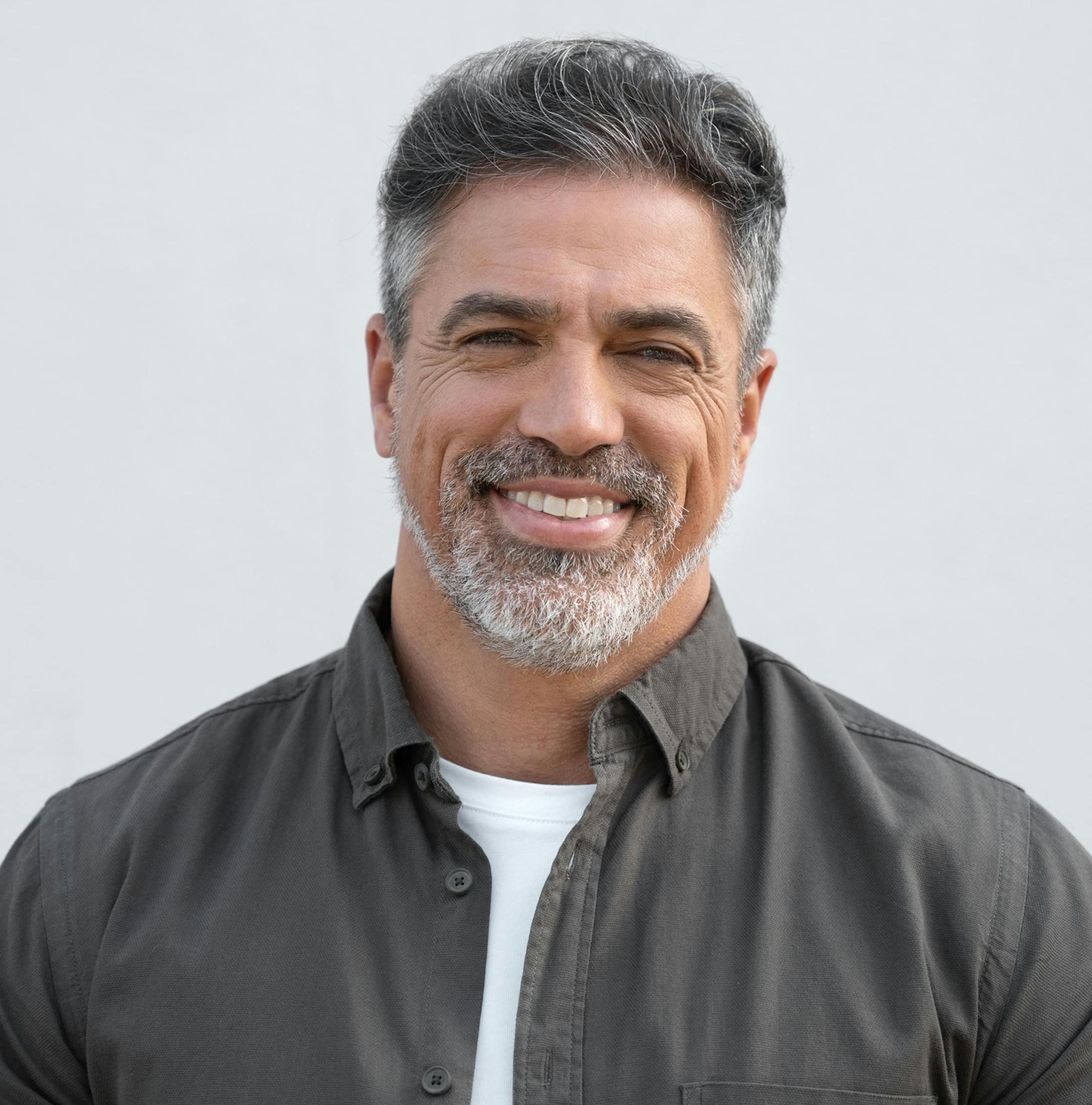 man with grey beard smiling