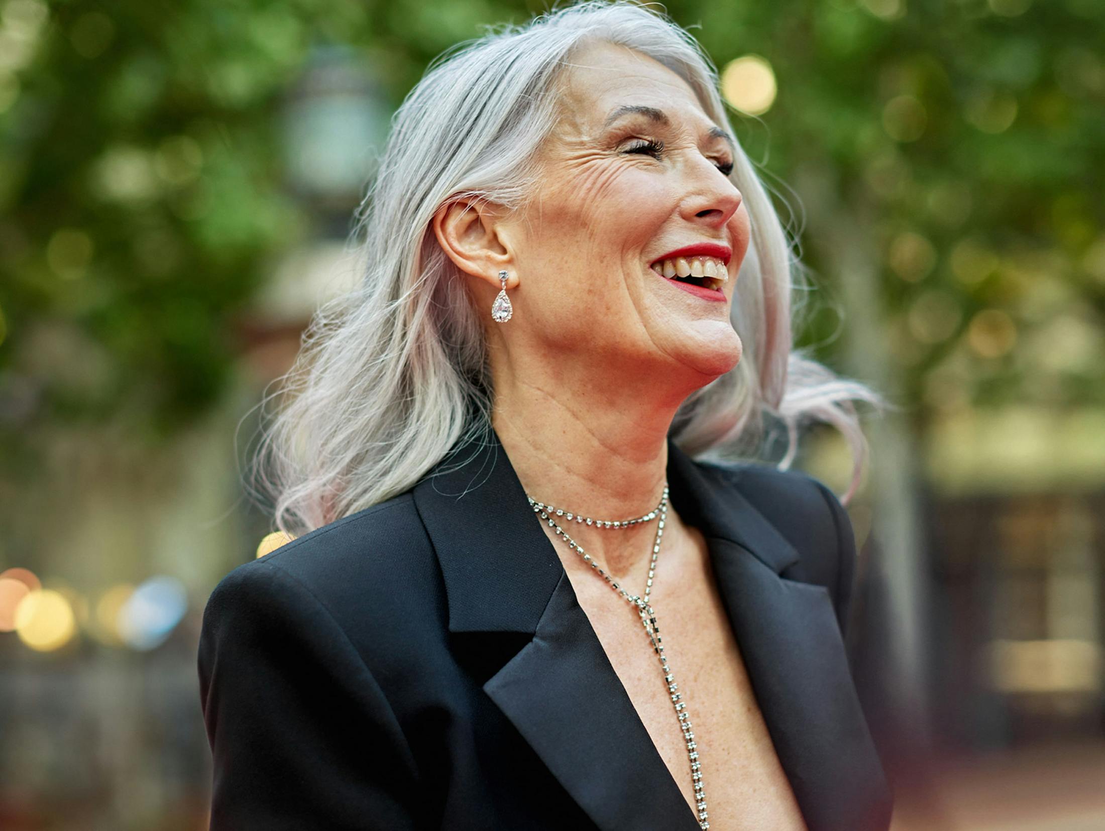 older woman smiling outside