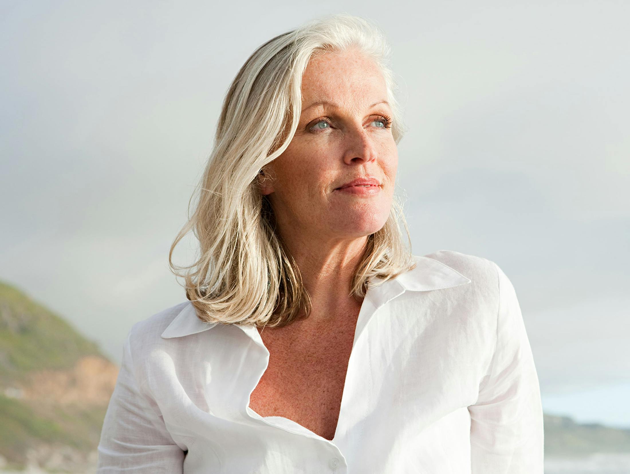 woman outside in white blouse