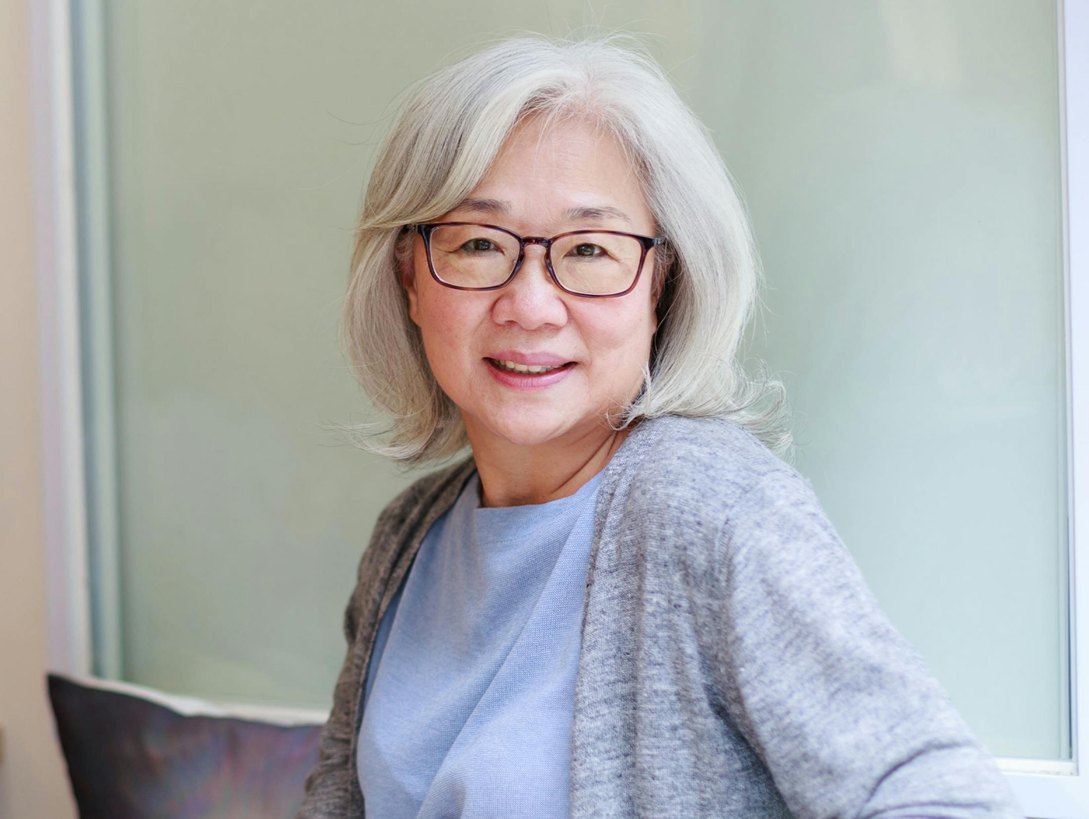 older woman sitting on couch