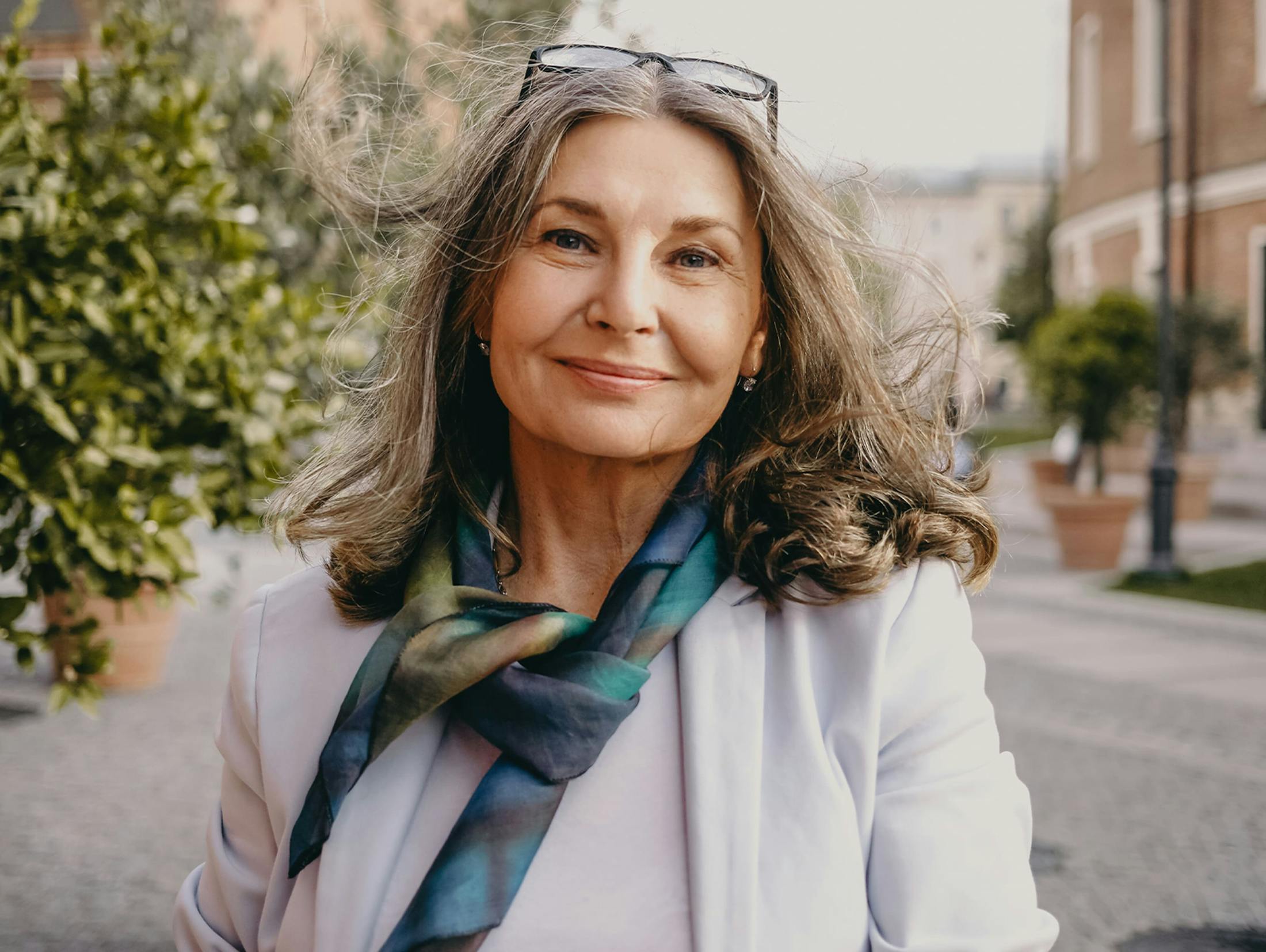 woman walking outside and smiling