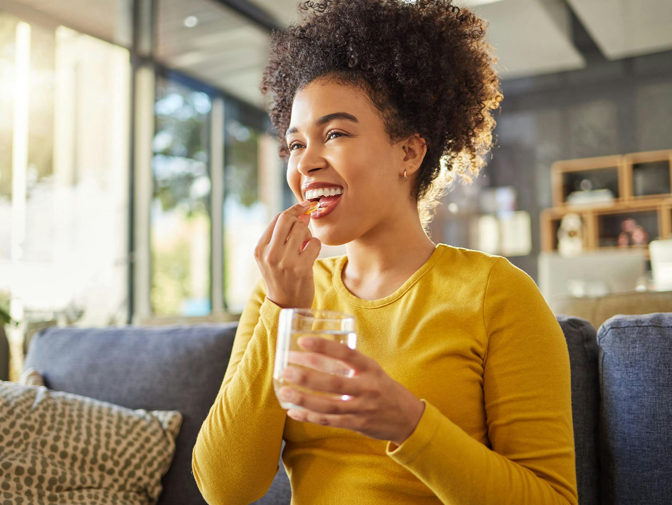 woman taking her vitamins