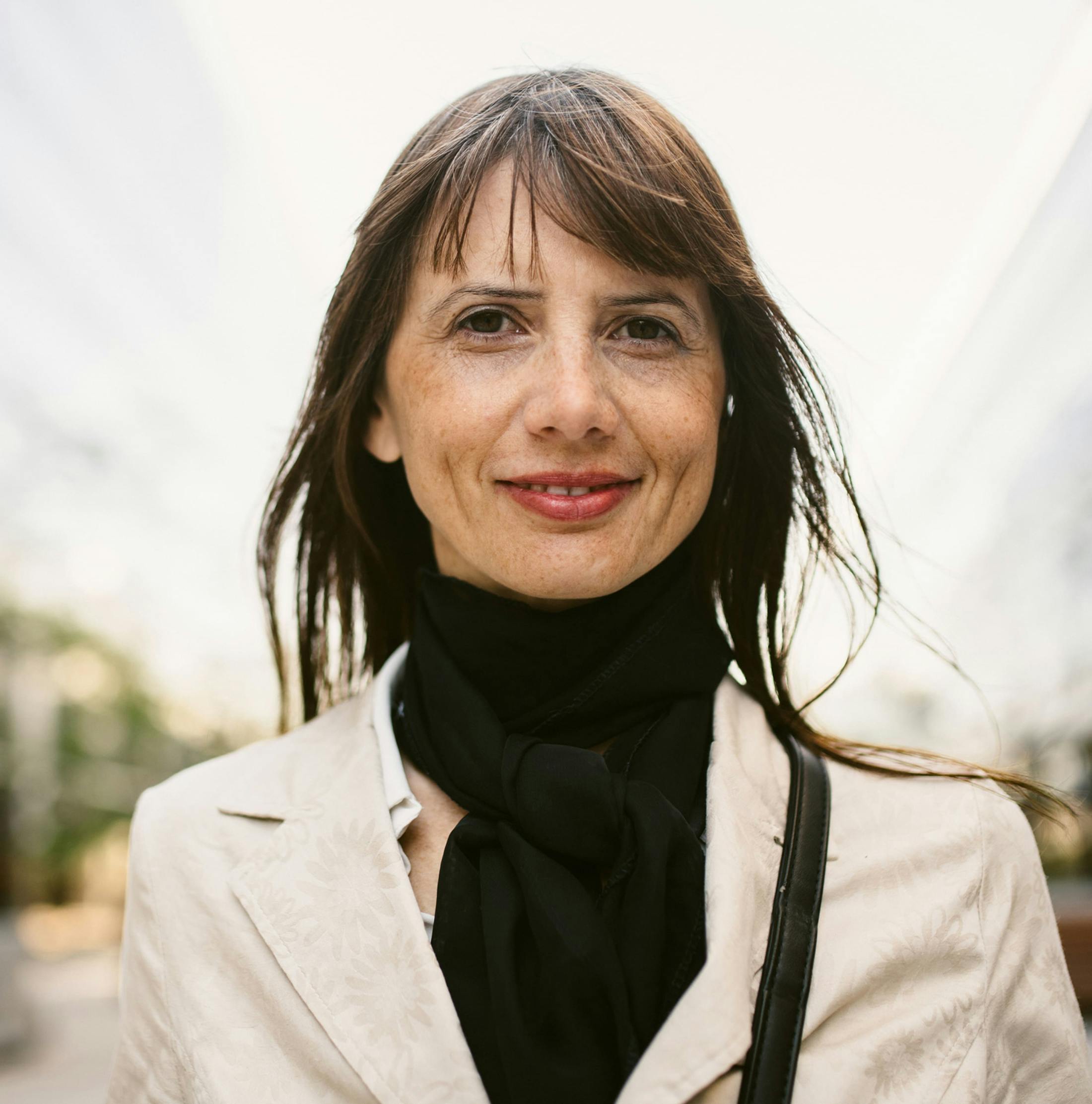 woman outdoors with jacket on facing forward