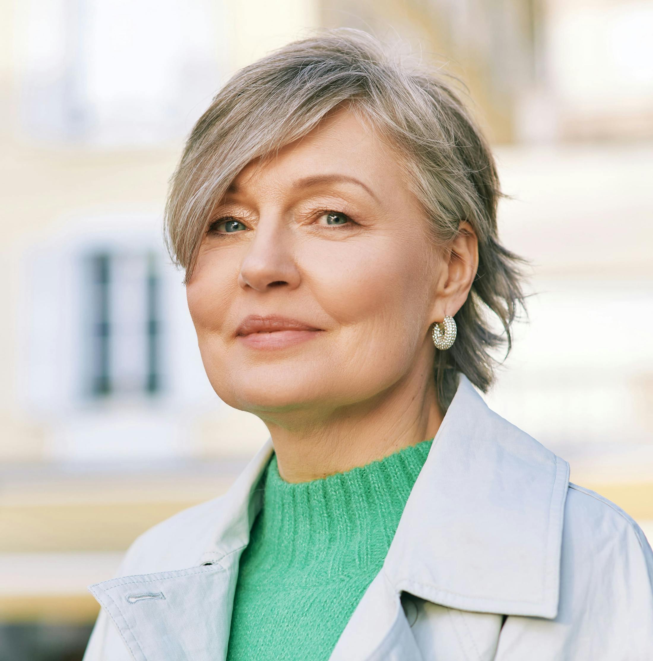 woman with short gray hair outside