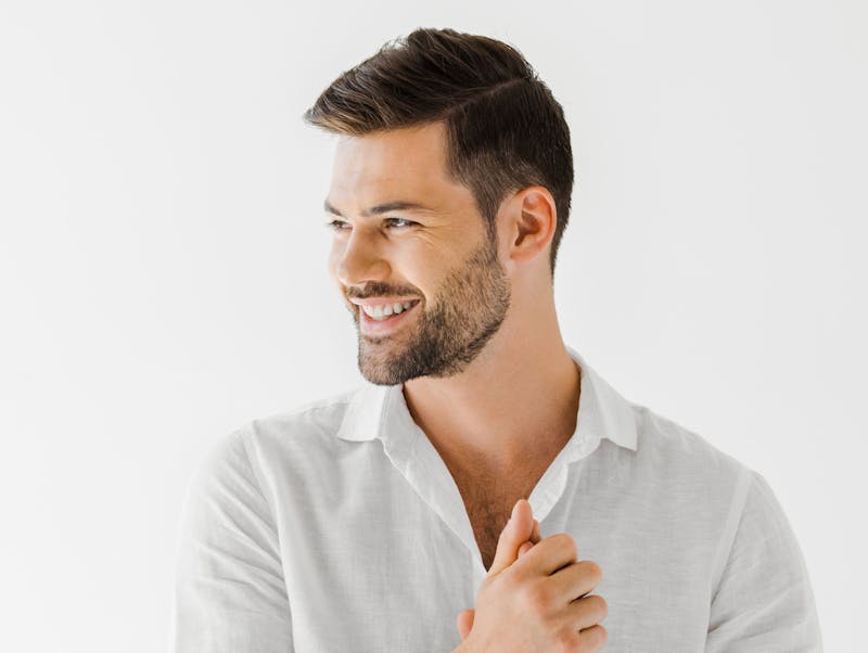 man smiling with his hands together