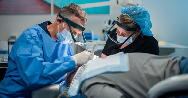 doctors performing hair transplant surgery