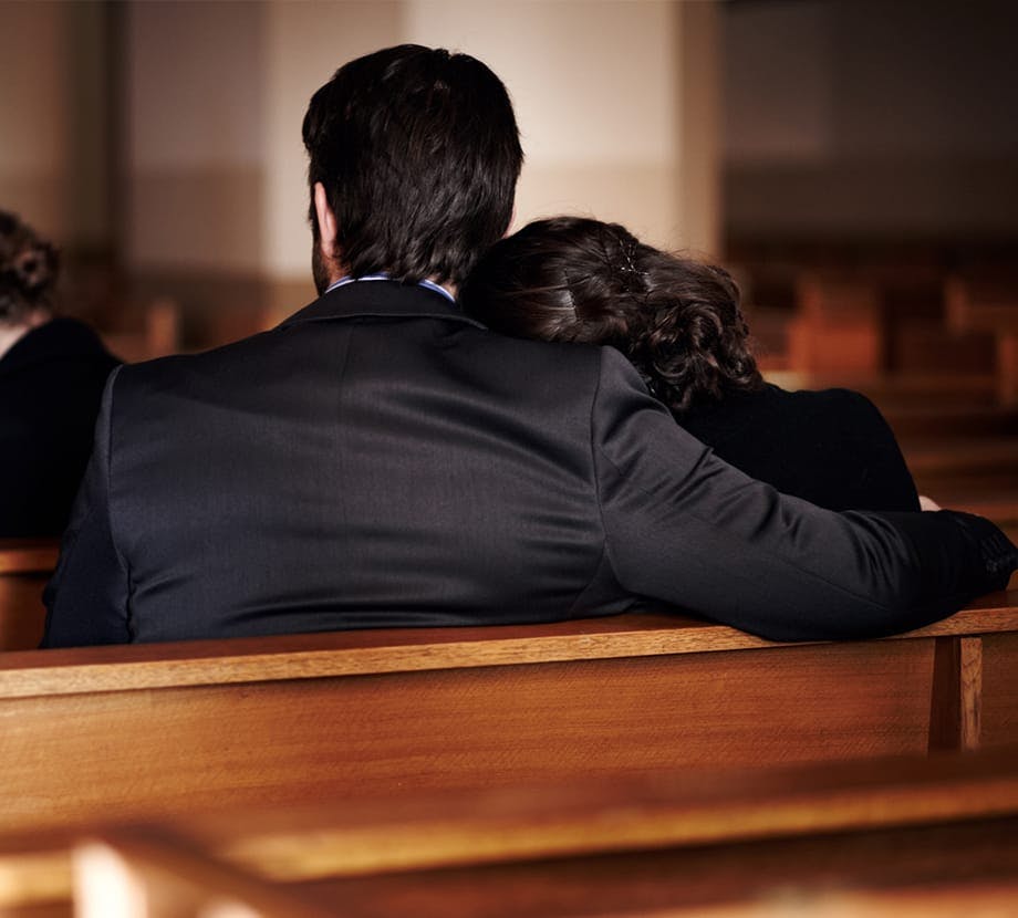Man and woman at a funeral