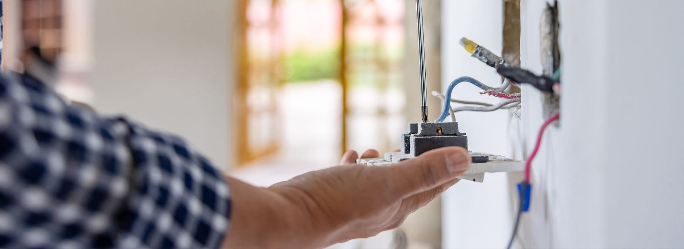 Man touching electrical outlet