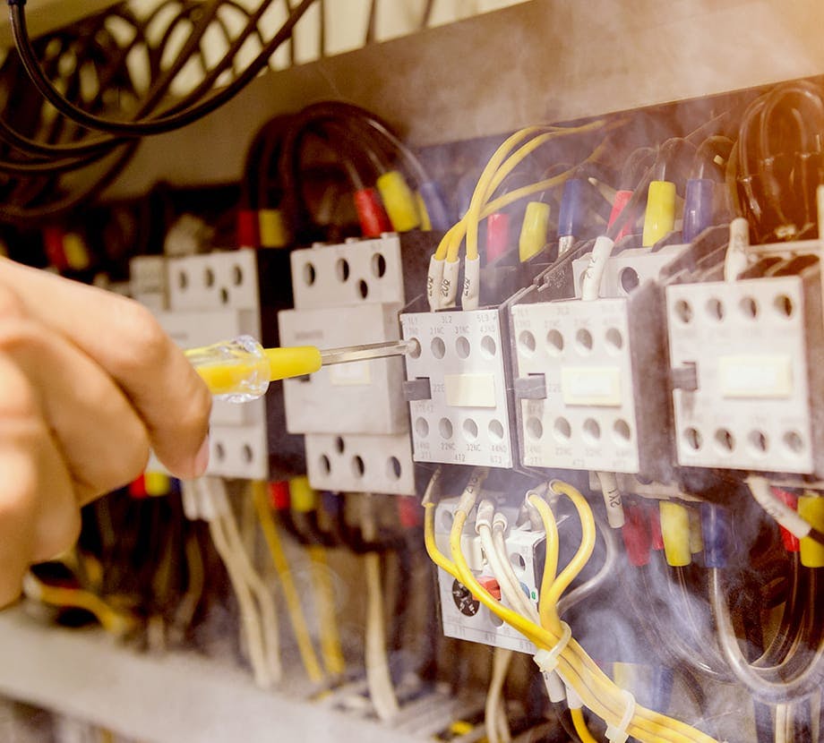 Man touching electrical wires