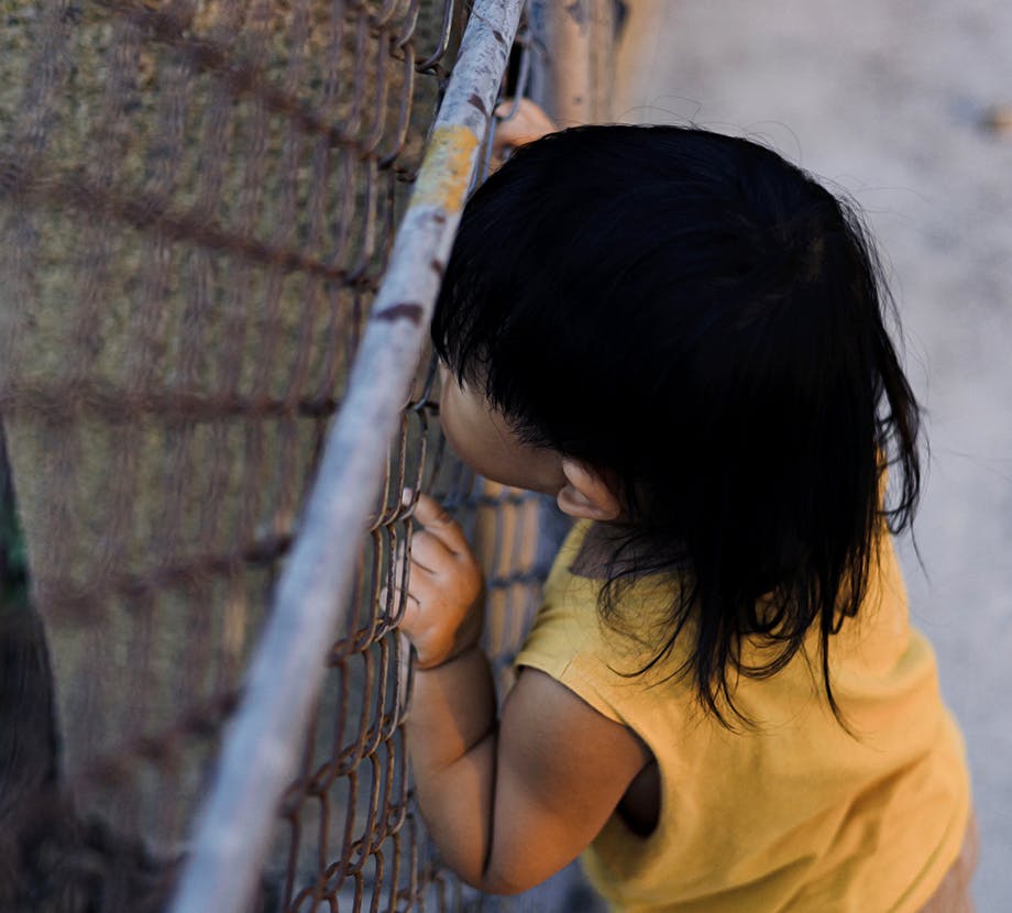 Kid on fence