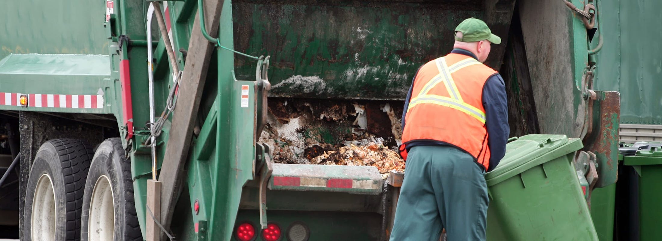 Garbage truck worker