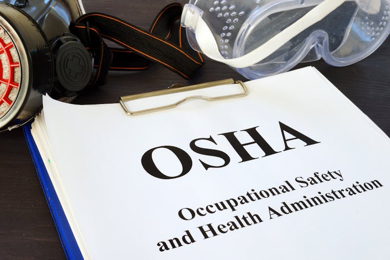OHSA form on a clipboard