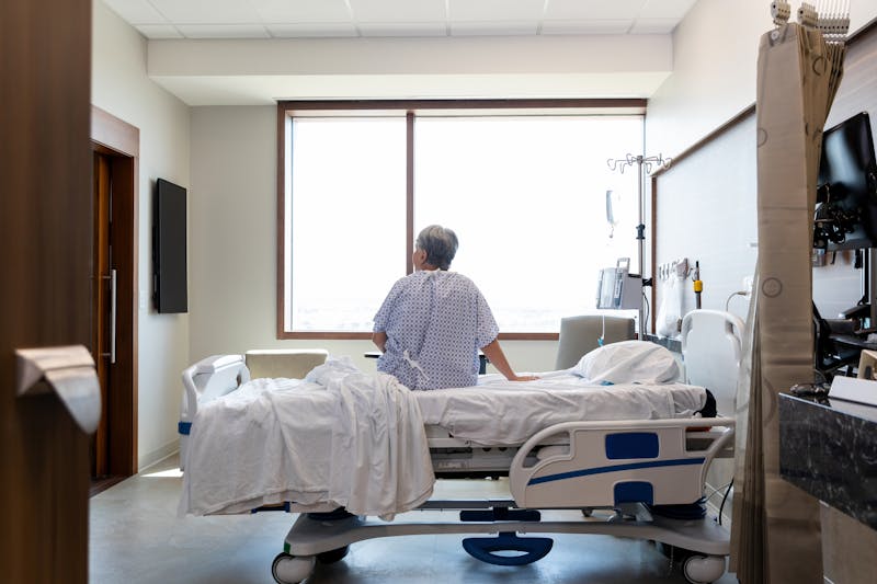 hospital patient looking outside a window