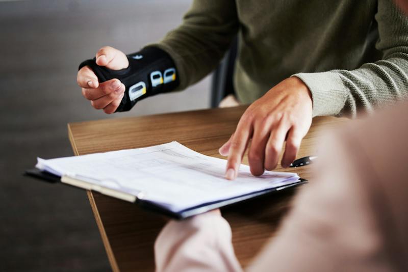 Person pointing at document