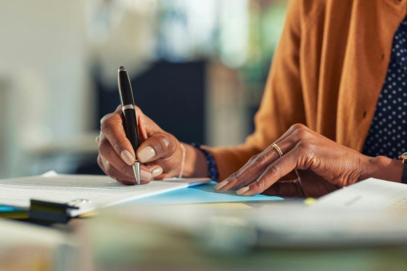 Woman signing documents