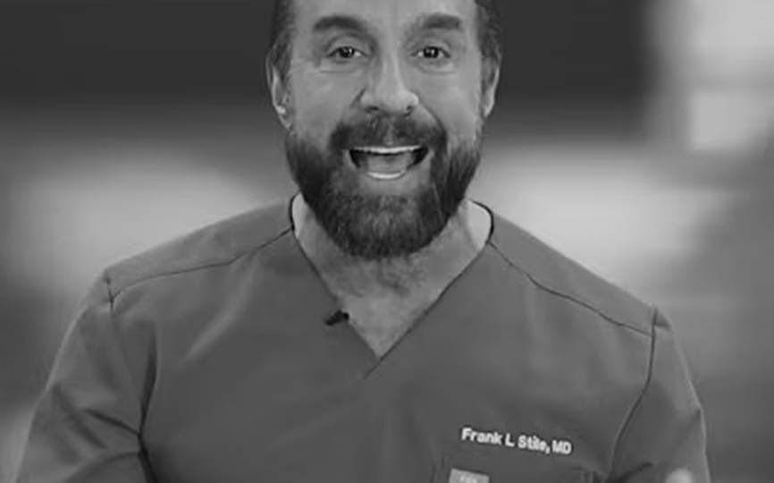 Doctor speaking in grayscale video still