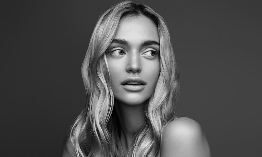 Woman looking off to the side smiling