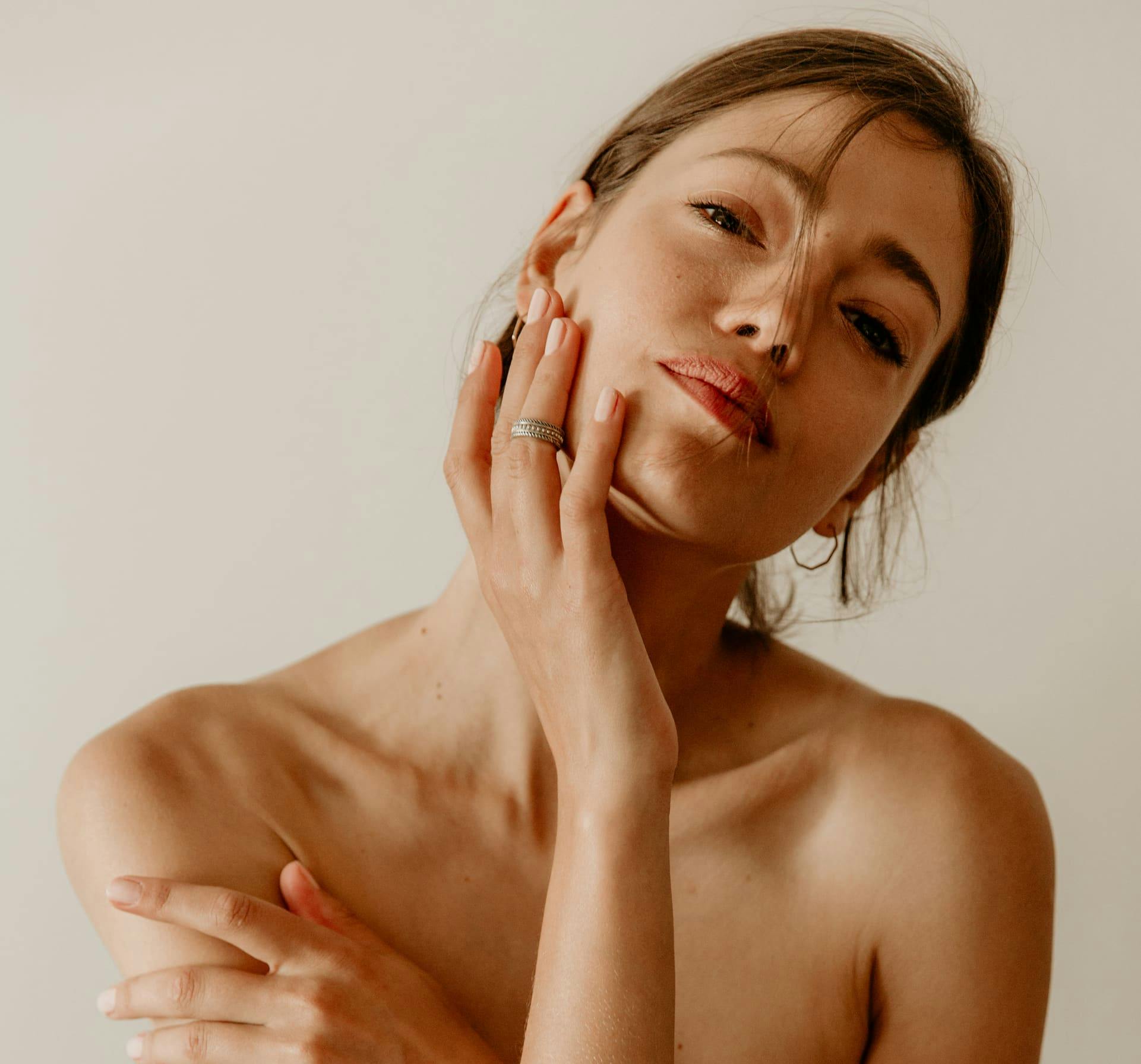 Woman resting chin on hand