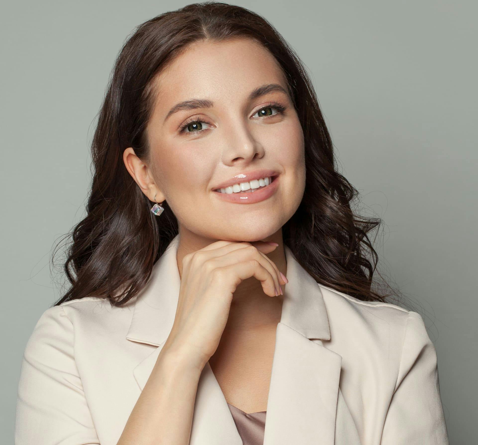 Woman smiling touching chin