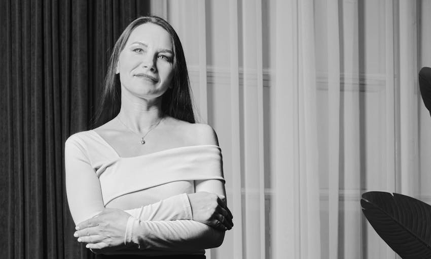 Woman crossing arms and smiling