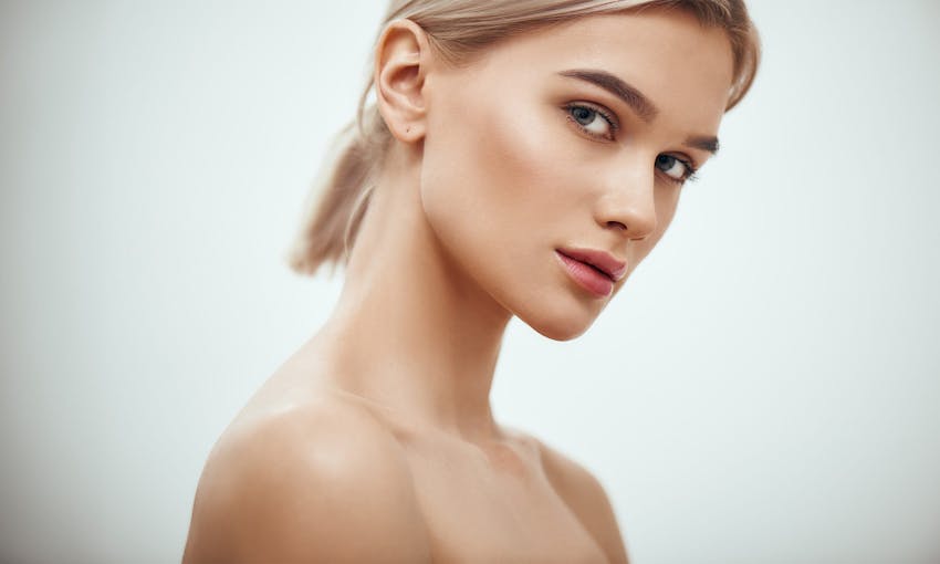 woman looking over her shoulder