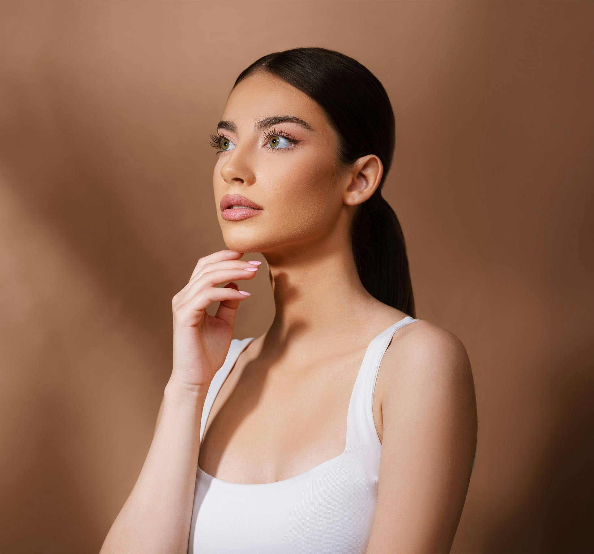 woman touching her chin