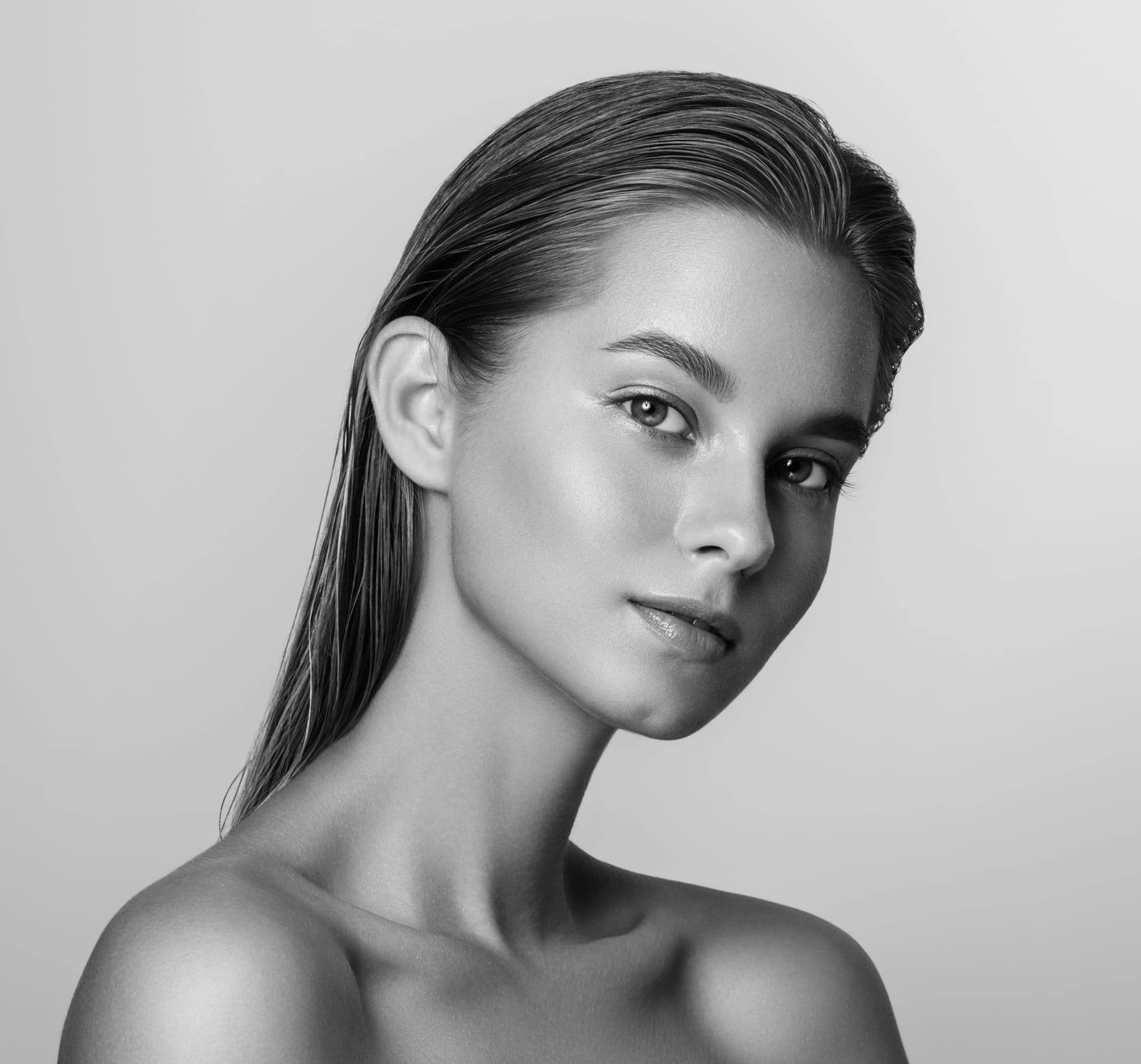 Black and white portrait of a woman with defined facial features