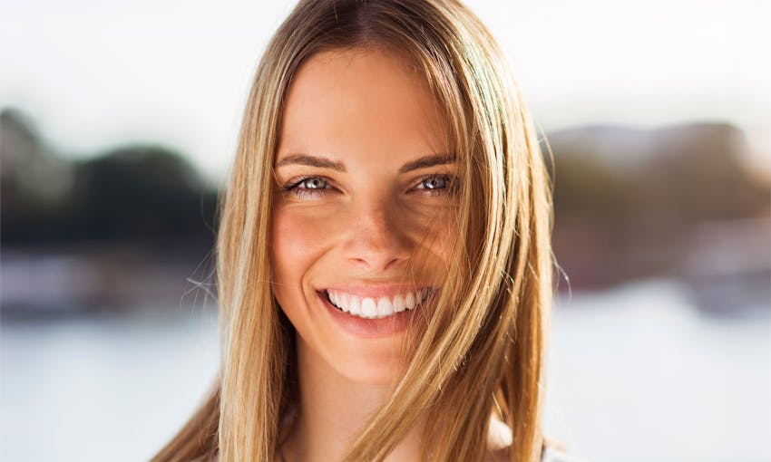 Woman smiling on the beach